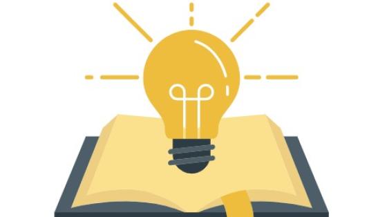 Bright lightbulb over an open book