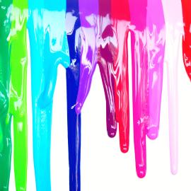 rainbow colors of paint running down a canvas
